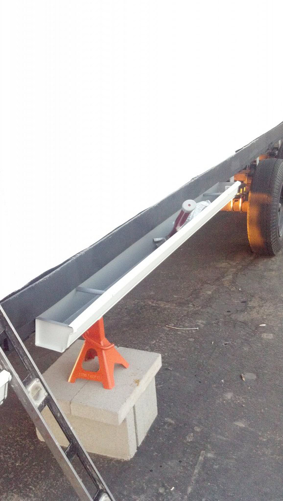 Here is a planter installed on the trailer. Soon I ought to be able to plant the ivy in there and get it going to start growing up the side of the house and over the roof.