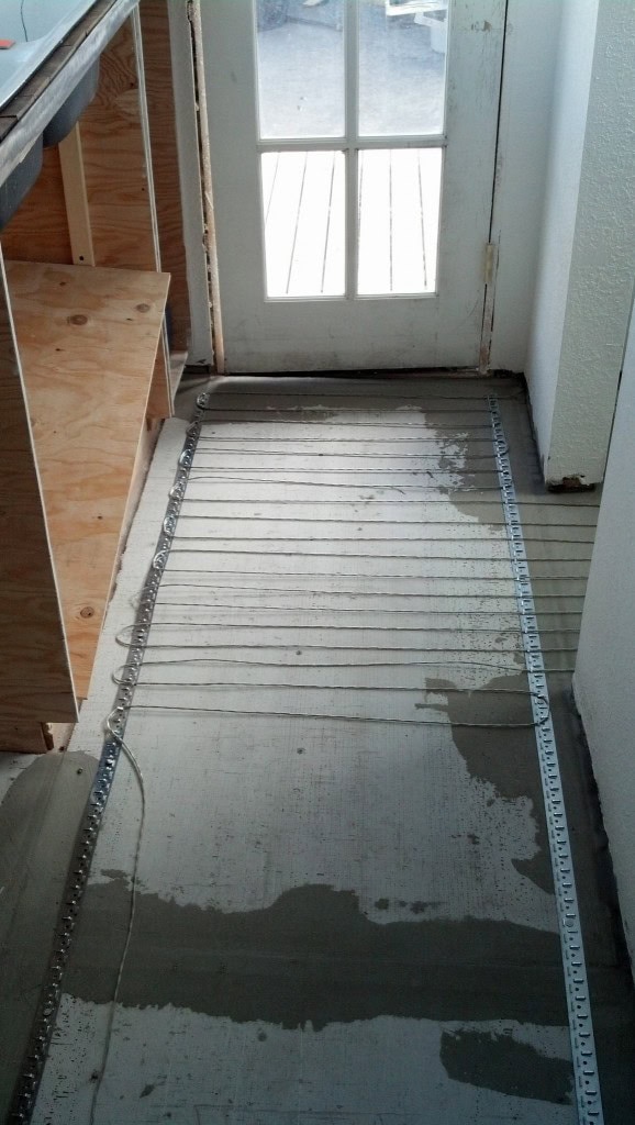 Zig-zag along... I did a 2.5" gap between the hall spaces and then the areas I will stand (in front of the kitchen sink and the bathroom sink) I did a 2" spacing so it's a little warmer there...