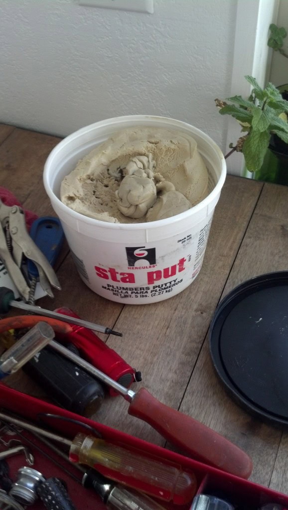 First thing he did was throw off the cheapo gaskets that it came with and use his plumbers putty