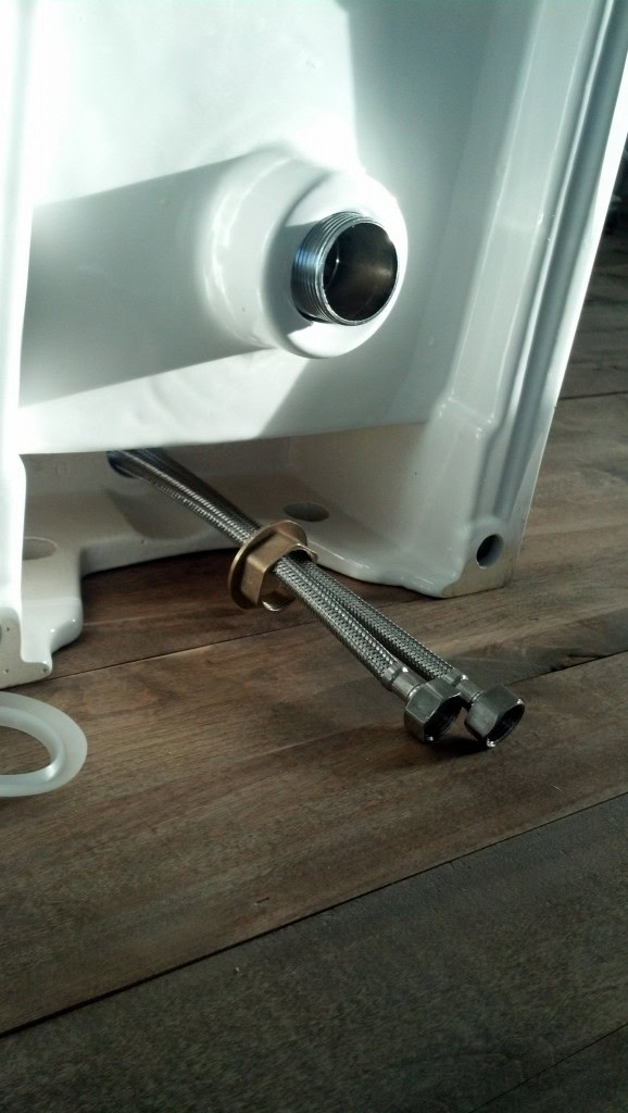 These are the parts that made it have to be assembled all together, they wouldn't fit through the sink together AND hook to the faucet so it had to be threaded through, hooked to the faucet and then put together