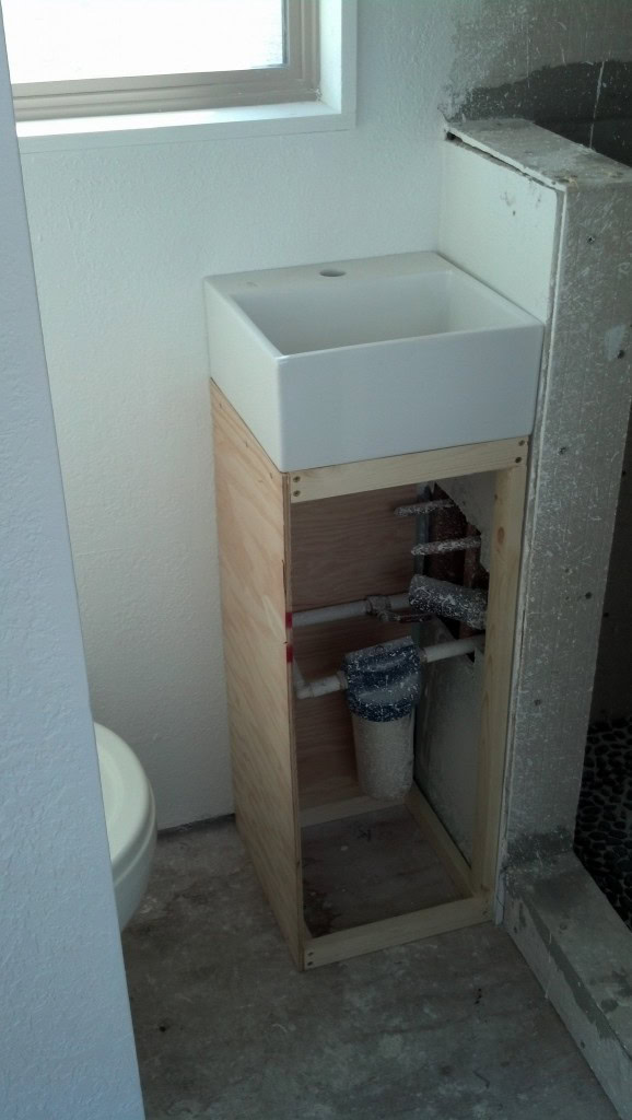 and my bathroom unit. This filter filters all of the water that comes into the house. I like how this looks and I love the sink! :) (I wasn't going to do this originally, I was planning on a sink share with the kitchen. I'm glad I added this though!