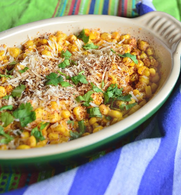 This super simple recipe using canned corn and parmesan cheese is so good. Flavored with chile and lemon you will find yourself making this over and over again! #corn #Mexicanrecipes #chile www.thisishowicook.com