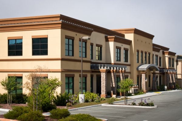 Wide angle view of modern office park building A corner view of a two story office building in an office park with an empty parking lot, in Monterey, California.