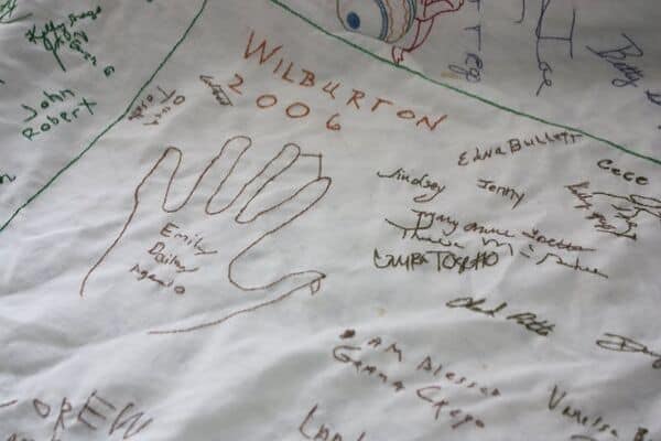 Thanksgiving Tradition: Family Tablecloth with signatures of everyone who came.