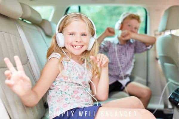 Car organization hacks: Two kids in the back of a clean and organized car