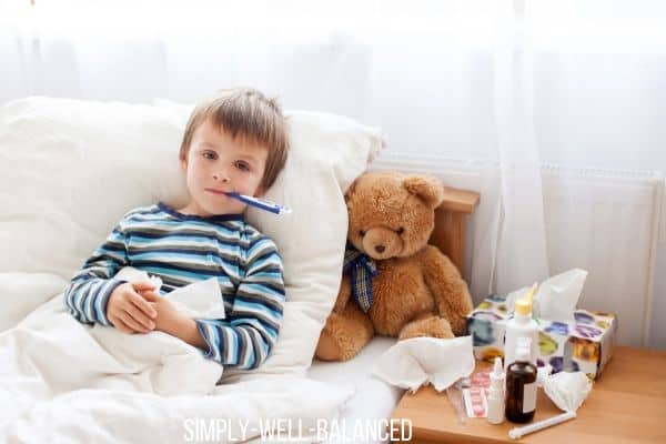 Child sick in bed with the flu