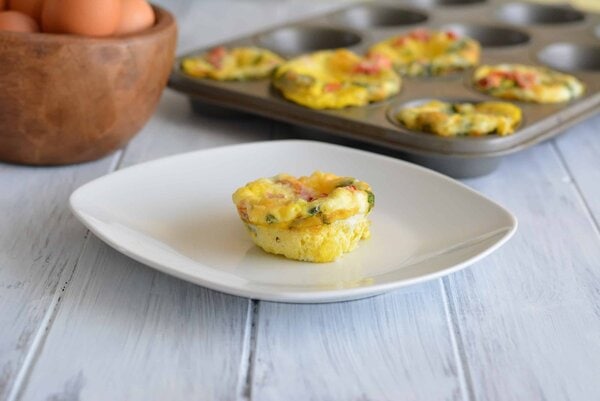 Roasted Pepper & Egg Breakfast Muffin on a white plate.
