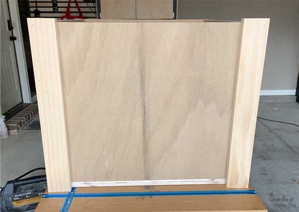 adding trim to Christmas tree shipping crate stand