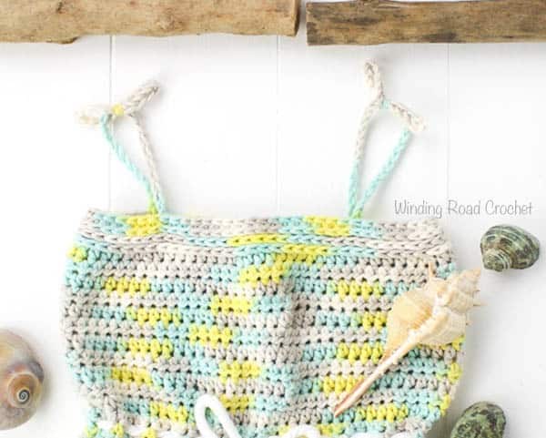 The beachside baby romper is the perfect summer baby shower gift! This quick and easy free crochet pattern was designed for begginers who are comfortable with the basic stitches. This is a beatiful and unique project and with sizes 3 months - 24 months this pattern is great for all baby girls! #crochet #crochetpattern #free #baby #babyromper #babycrochet