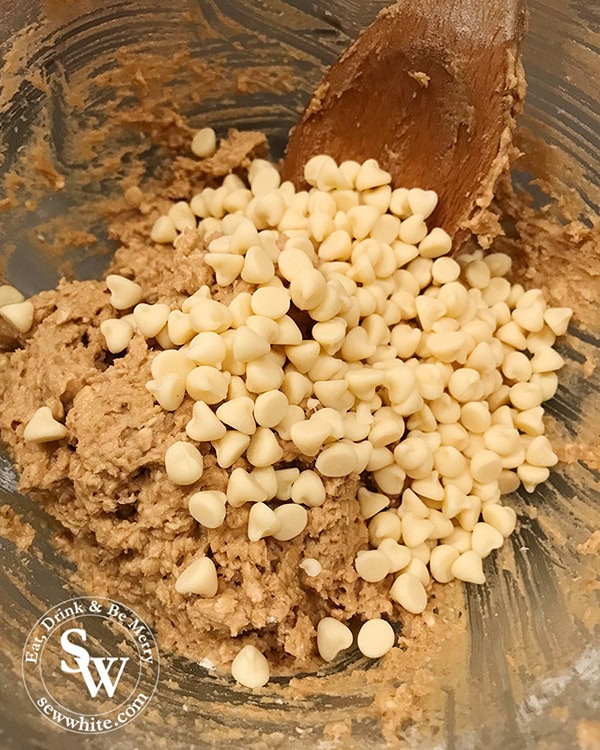 Add the white chocolate chips into the cookie mix