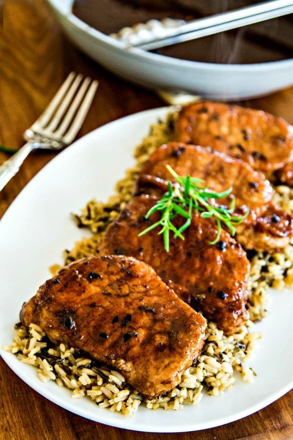 balsamic pork chops on a white platter