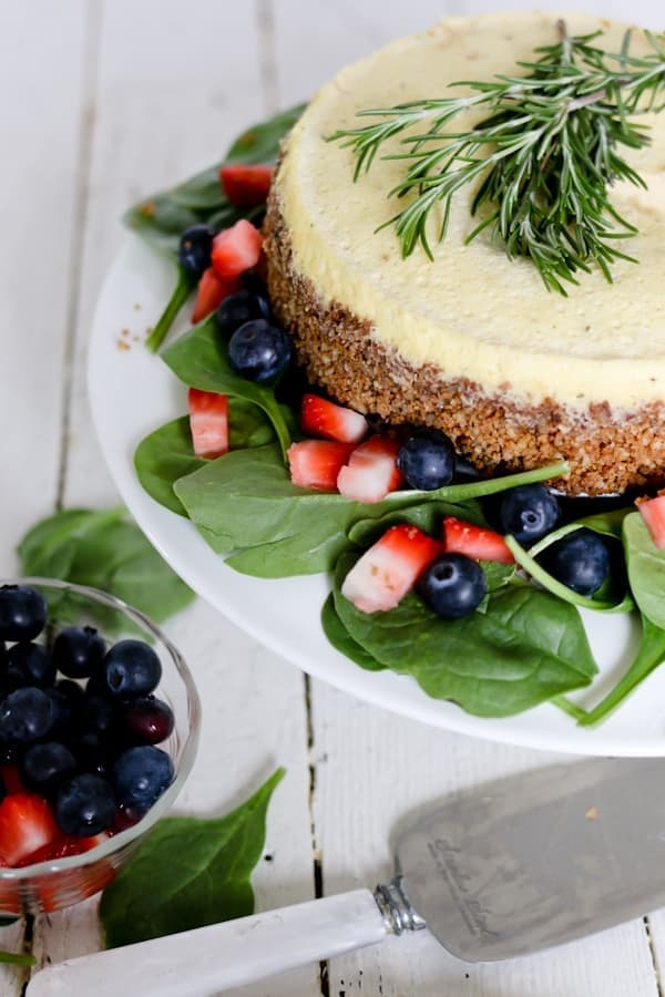 Top down shot of a blue cheese cheesecake dressed with fresh fruit