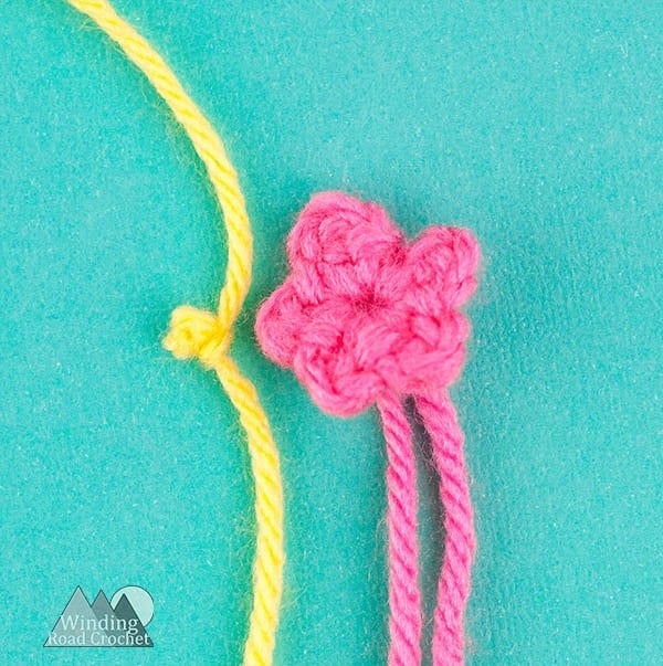 Crochet a cute amigurumi gnome with this free crochet pattern. The garden gnome is a perfect spring project and works up quick. Using only basic stitches this garden gnome is an easy project. Crochet one to watch over your garden. #crochetgnome #amigurumicrochet #springcrochet