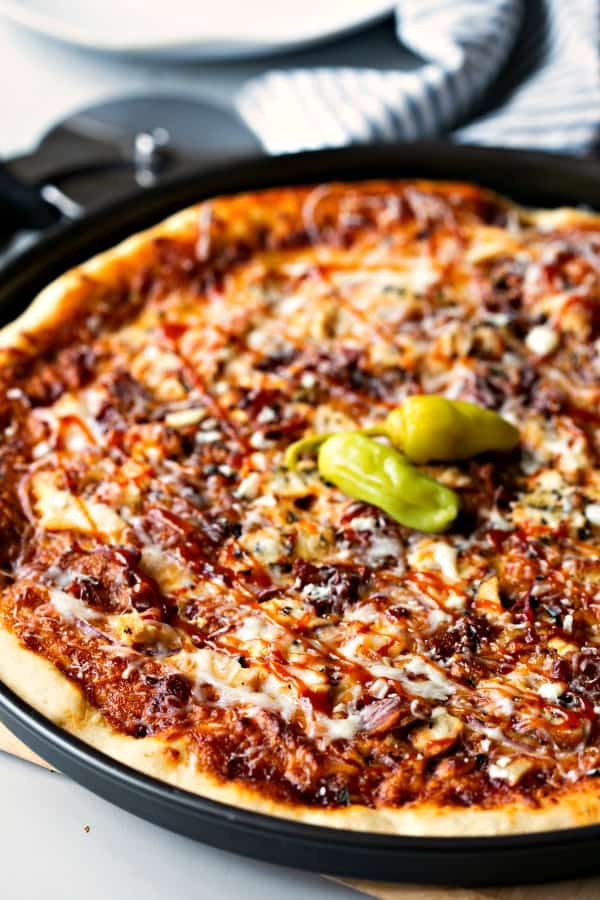 Barbecue Chicken Pizza garnished with pepperoncini peppers