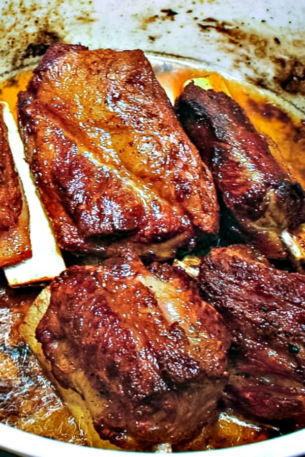 Braised Short Ribs simmering in pot