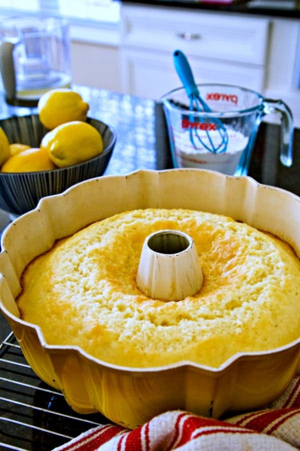 cake cooling in a bundt pan on a wire rack