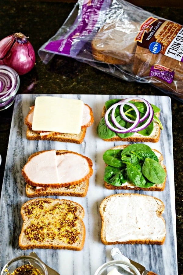 assembling turkey melt sandwiches
