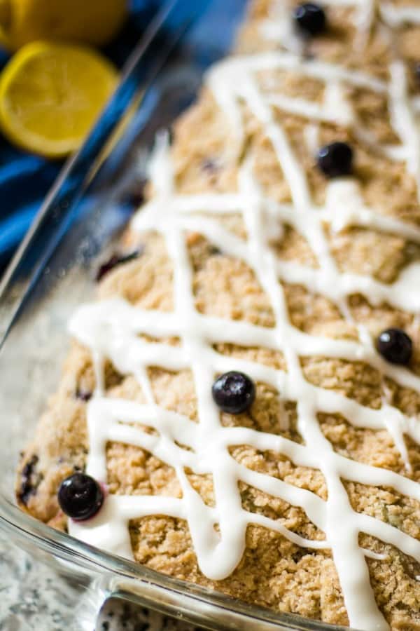 corner of blueberry coffee cake in glass dish