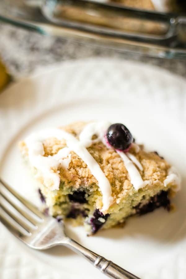 blueberry crumb cake with a bite missing