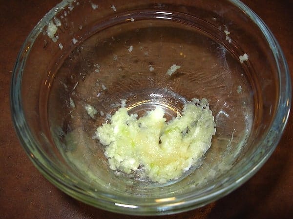 Step 1: Mix the garlic and the salt.