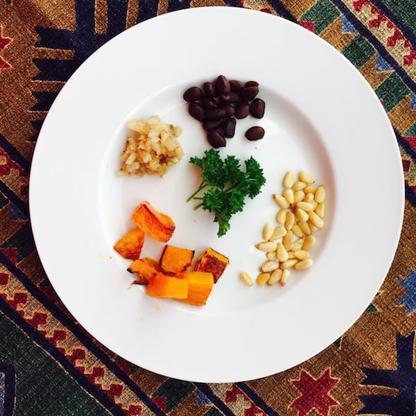 Pine nuts, roasted butternut squash, brown rice and black beans make a pretty appetizer.