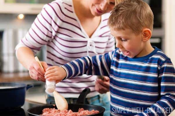 A family cooking a frugal ground beef dinner recipe.