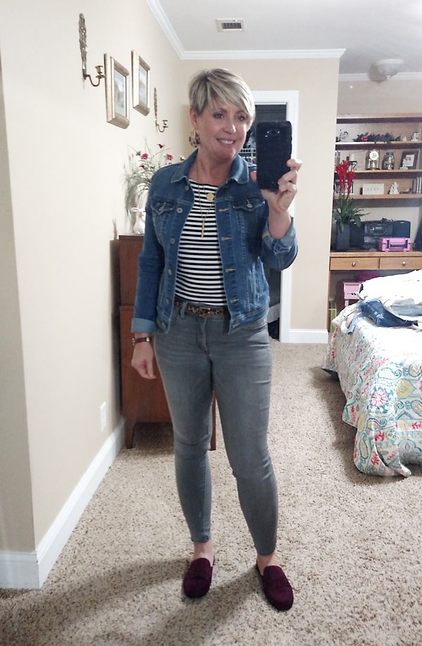 denim jacket with striped top and grey jeans