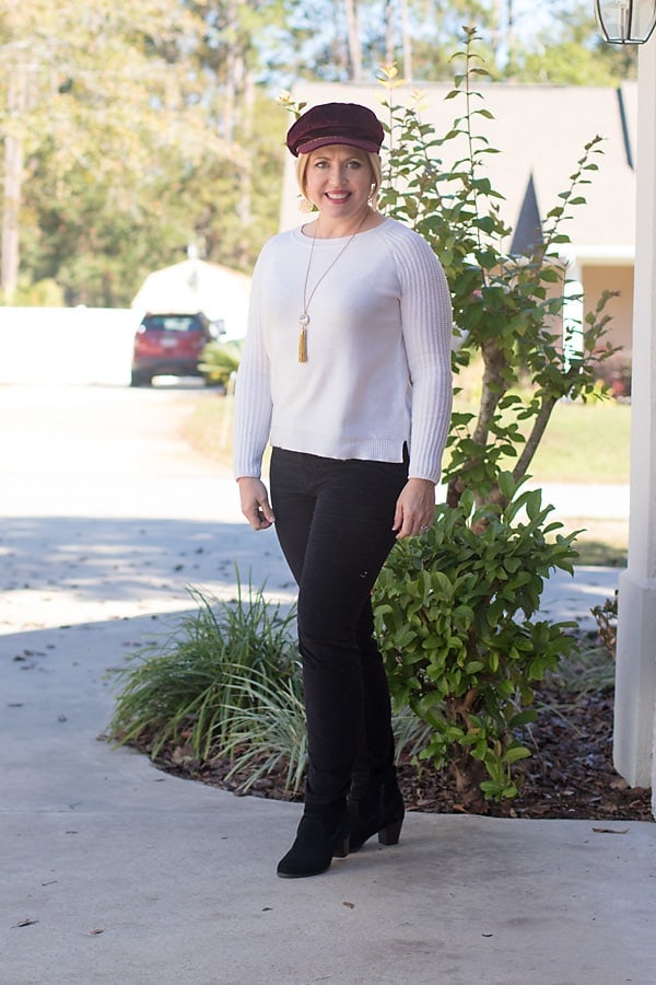 cream sweater and velvet pants