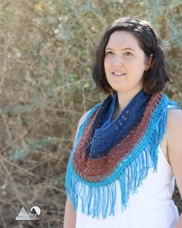 The Odyssey Cowl is a light and unique fall accessory. This free crochet pattern is quick and easy and great for beginners. It makes a wonderful roadtrip project or christmas gift. Pair this with a light jacket and jeans and you have a perfect fall outfit. #crochet #freepattern #fallcrochet #fall #handmadegift