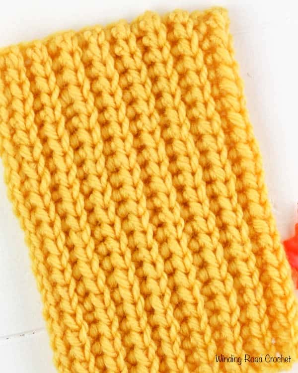 The yarn over slip stitch is an easy crochet stitch that makes a beautiful knit like ribbed texture. This stitch is great for hats, scarves and even sweater. I have a video free right and left handed video tutorial to show you how to crochet this stitch. #howtocrochet #crochet #crochetstitch