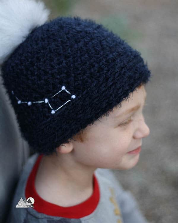 Learn to crochet this easy for beginners constellation beanie. Each beanie is as unique as a star with 16 constellation templates to choose from and adult, child and baby sizes. Get the free crochet pattern and learn an easy way to add star details to your crochet hat.
