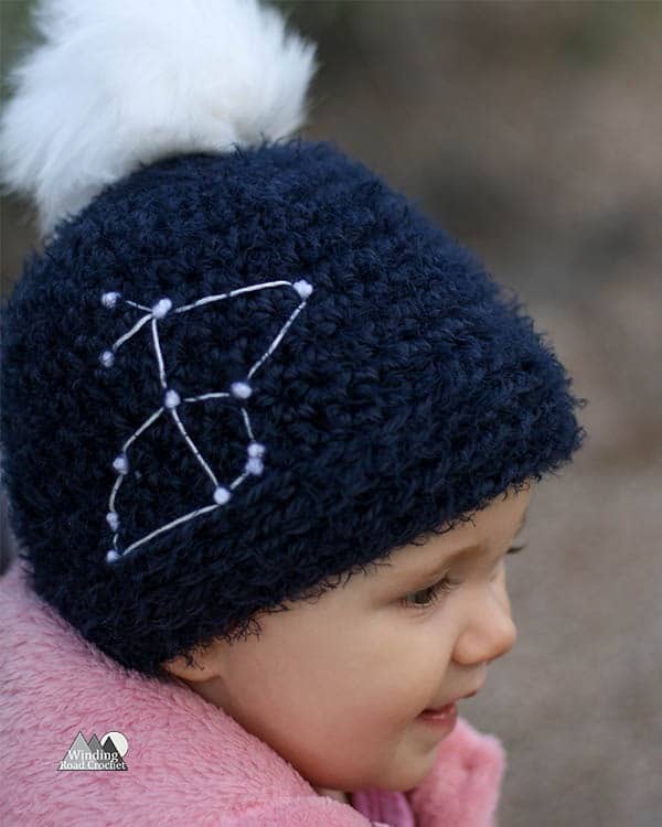 Learn to crochet this easy for beginners constellation beanie. Each beanie is as unique as a star with 16 constellation templates to choose from and adult, child and baby sizes. Get the free crochet pattern and learn an easy way to add star details to your crochet hat.