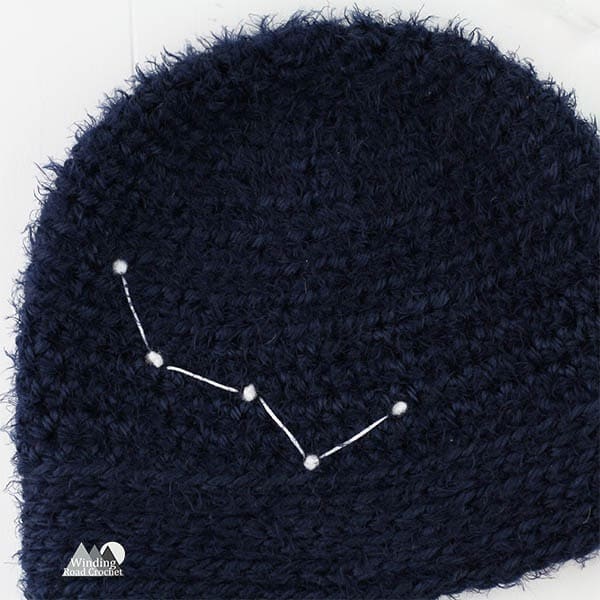 Learn to crochet this easy for beginners constellation beanie. Each beanie is as unique as a star with 16 constellation templates to choose from and adult, child and baby sizes. Get the free crochet pattern and learn an easy way to add star details to your crochet hat.