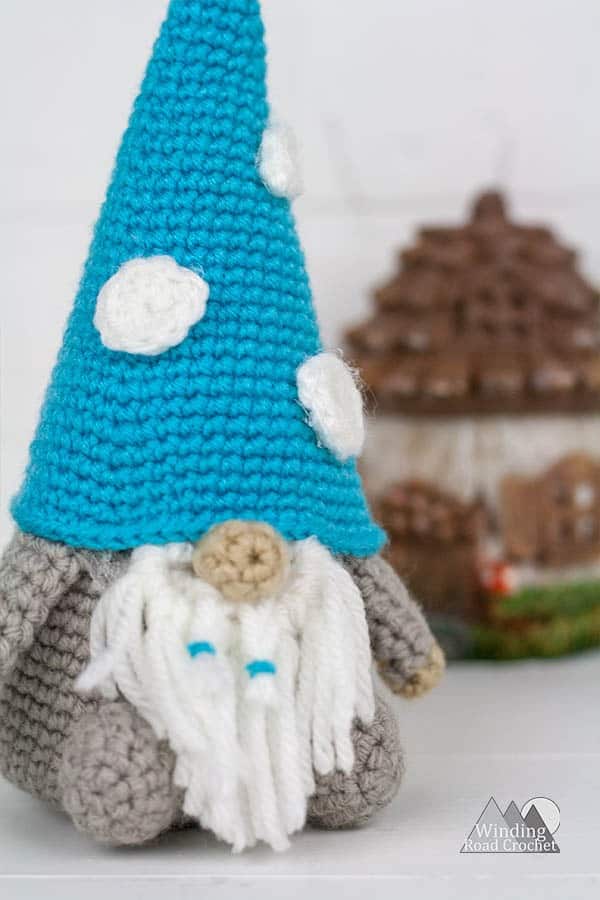 Crochet a cute amigurumi gnome with this free crochet pattern. The garden gnome is a perfect spring project and works up quick. Using only basic stitches this garden gnome is an easy project. Crochet one to watch over your garden. #crochetgnome #amigurumicrochet #springcrochet