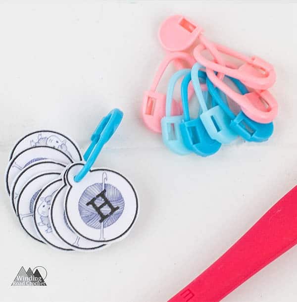 Learn how to use crochet stitch markers and some extra tips and tricks for using stitch markers. Also learn where to get the printable stitch marker tags. #crochettips #stitchmarkers #crochetstitchmarkers