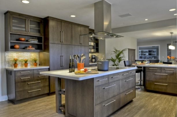 slab floor to ceiling cabinets with sleek stainless steel handles