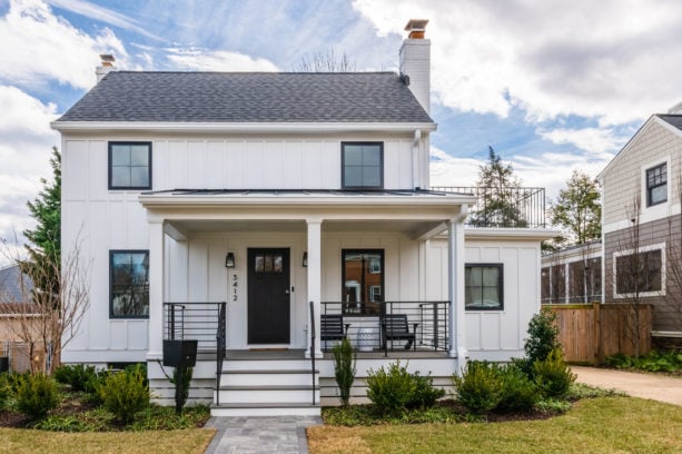 accentuating black trim in a transitional white house