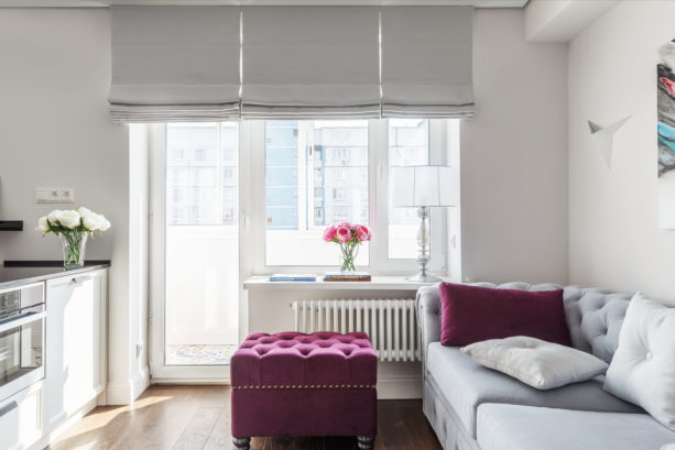 cloud grey flat roman shade in a transitional living room