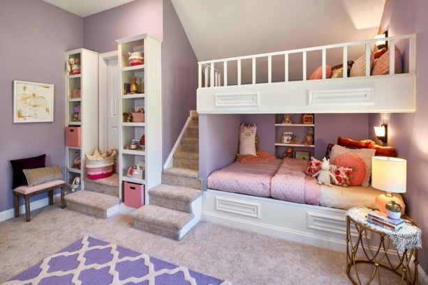 a traditional pink and purple shared bedroom for little girl and teen