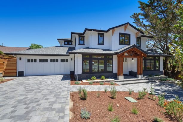 a white transitional house with wide black trim for boldness