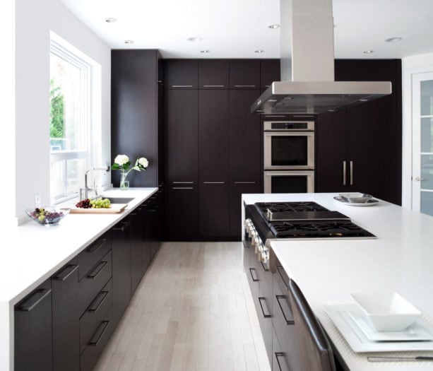 ebony-colored floor to ceiling cabinets made out of maple wood