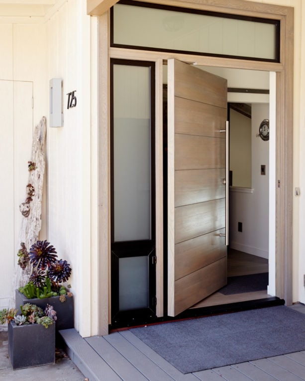contemporary white oak Solace front door with custom frame and threshold by Pivot Door Company