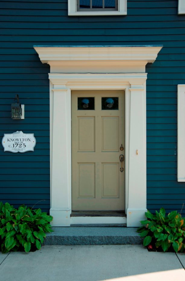an intricate front door trim with wider size