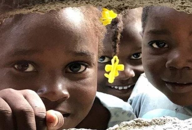 fence1 Three Haitian Girls. Global Health Teams - Haiti Medical Volunteer