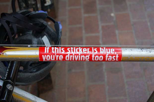 Sticker on a bike frame that says If This Sticker is Blue You're Driving Too Fast
