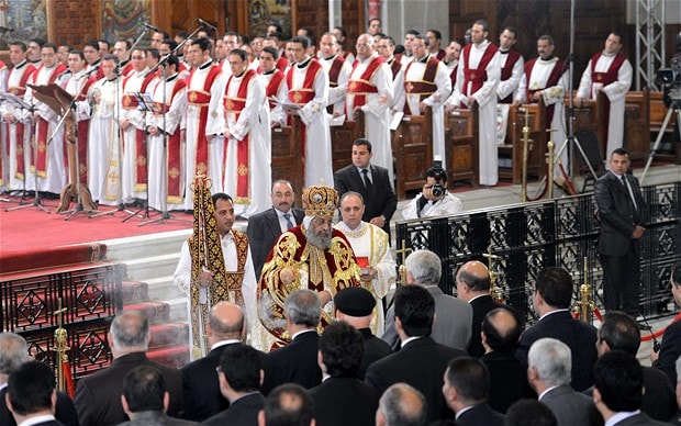 Head of the Egyptian Coptic Orthodox Church, Pope Tawadros II, leads the Coptic Christmas midnight mass at the al-Abasseya Cathedral in Cairo last night Photo: AFP/GETTY