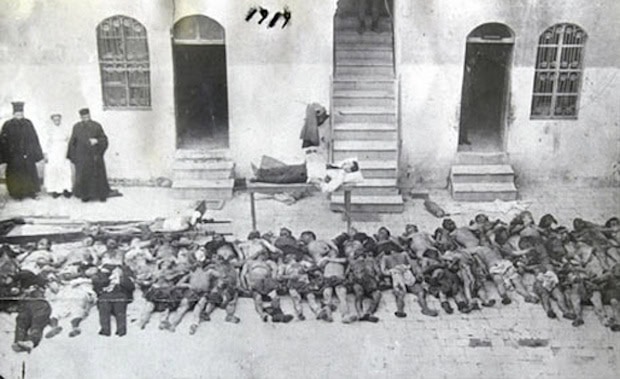 A Greek Orthodox priest looks at his massacred flock. Photo from the archives of the German Deutsche Bank, which was working in the region financing a railway network when the killings began
