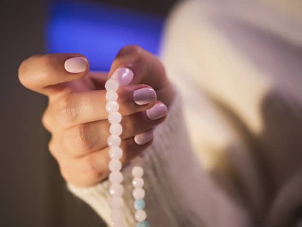 mala beads meditation pink mala beads in hand with pink nails