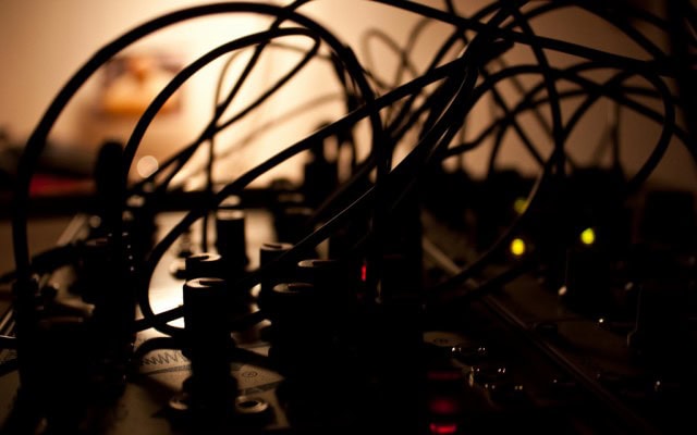 Late at night, patching cables in Make Noise's brilliantly-named "Maths" module. Photo (CC-BY) x2mirko - another German artist using American modules in the homeland of Eurorack.