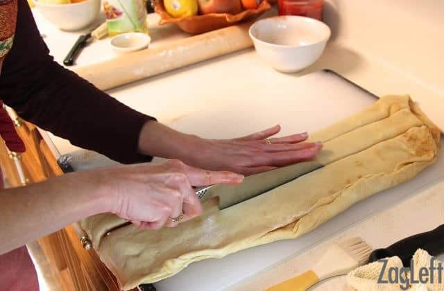 Cutting the folded dough into three strips